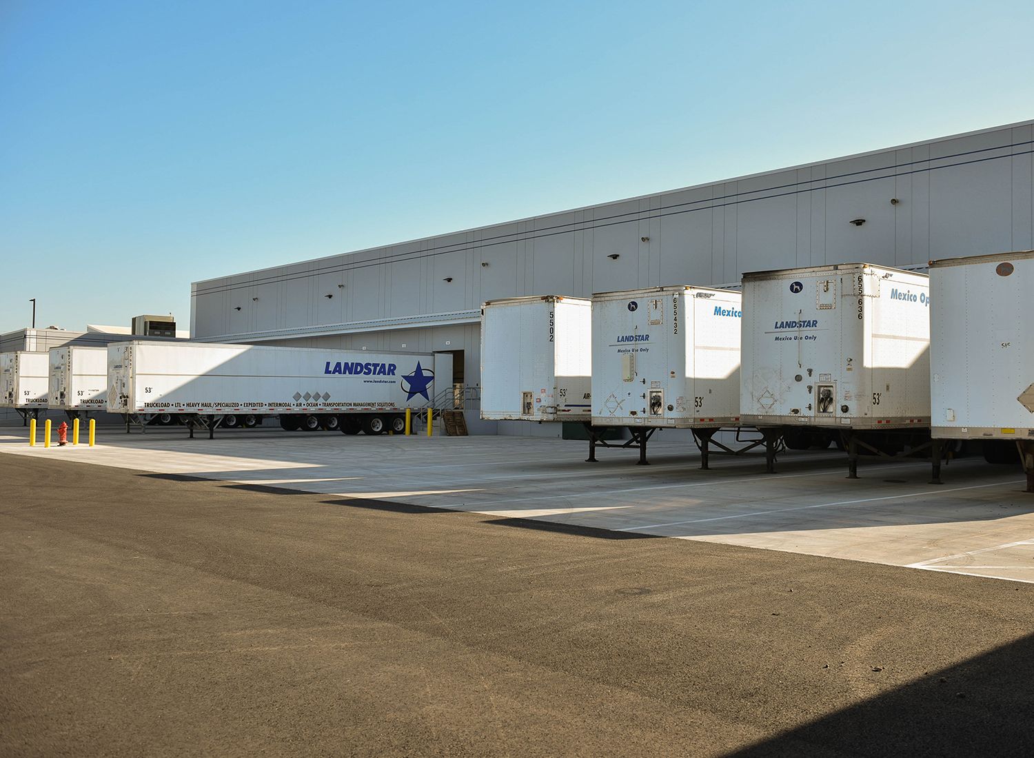 Containers and freight staged for port drayage and truckload